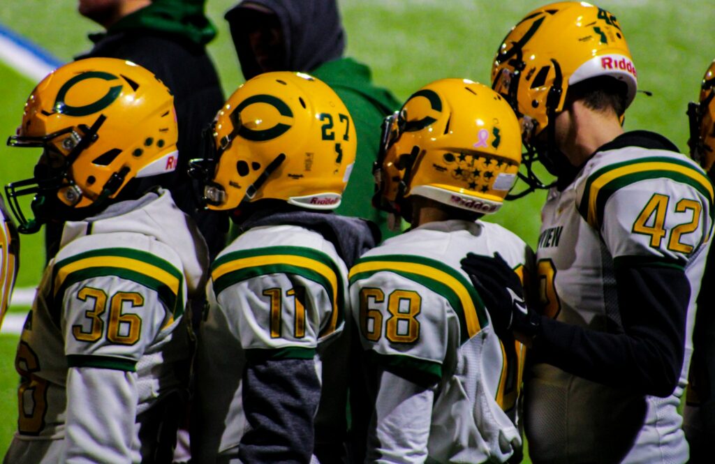 Pop’s Sports Weekly Breakdown | From Legends to Rookies—This Week in Sports Has It All 3 a group of football players standing next to each other